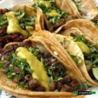 Tacos · Served with onions and cilantro or lettuce and tomato.