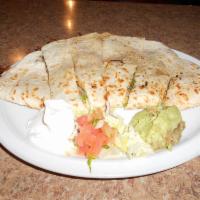 Super Quesadilla · Flour tortilla, melted Jack and cheddar cheese, your choice of meat. Garnished with sour cre...