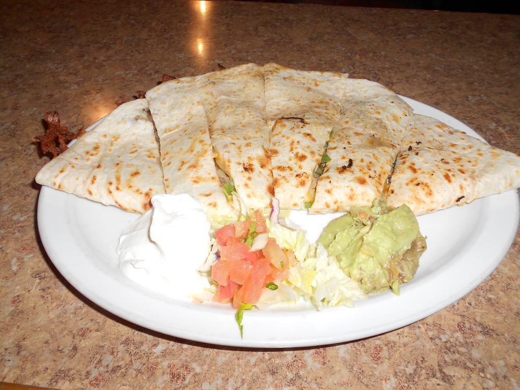 Super Quesadilla · Flour tortilla, melted Jack and cheddar cheese, your choice of meat. Garnished with sour cream, guacamole, lettuce, and pico de gallo.