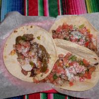 3 Tacos Tijuana · 6 corn tortillas filled with carne asada, rancho beans, radishes, pico de gallo, jalapeno sl...