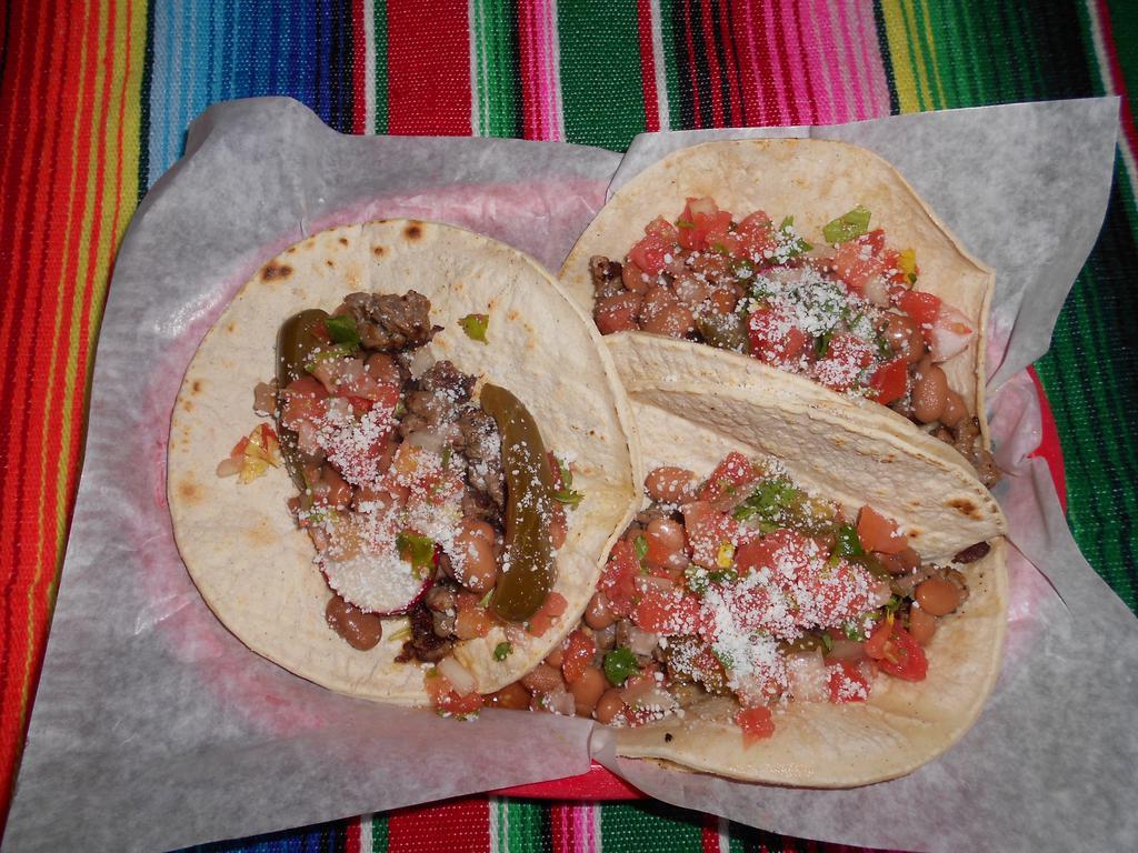 3 Tacos Tijuana · 6 corn tortillas filled with carne asada, rancho beans, radishes, pico de gallo, jalapeno slices and sprinkle of cotija cheese.