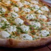 White Pizza · Hand tossed, bechamel, mozzarella, ricotta, Parmesan, roasted garlic puree and Italian parsl...