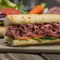 Pastrami Sandwich · Thinly sliced lean pastrami, served hot (or cold) on our freshly baked sourdough bread.