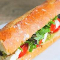 Caprese Sandwich  · Fresh Mozzarella cheese, pesto aioli, lettuce,tomatoes, drizzled with a balsamic glaze.
