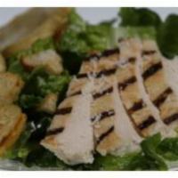 Grilled Chicken Caesar Salad · Chopped romaine, shaved Parmesan, grilled chicken, sourdough croutons and Caesar dressing.