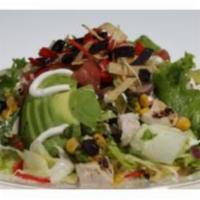Southwest Chicken Salad · Spring Mix and chopped romaine, grilled chicken, sliced avocado, black bean corn salsa, tort...