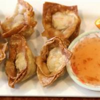 3. Crab Delight  · Crab meat mixed with cream cheese and wrapped in wonton sheets, Deep-fried, then served with...