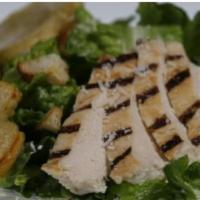 Grilled Chicken Caesar Salad · Chopped romaine, grilled chicken, shaved Parmesan, and sourdough croutons tossed in caesar d...