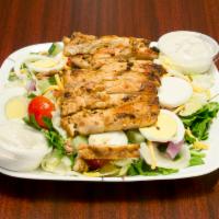 Tossed Salad with Grilled Chicken · Cajun seasoned grilled chicken, spring mix, cherry tomatoes, onion, cucumbers, egg, snd baco...