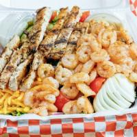 Tossed Salad with Grilled Chicken and Shrimp Salad · Cajun seasoned grilled chicken and shrimp, spring mix, cherry tomatoes, onion, cucumbers, eg...