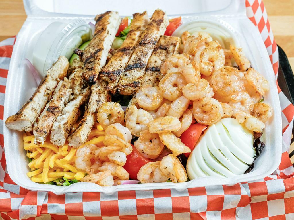 Tossed Salad with Grilled Chicken and Shrimp Salad · Cajun seasoned grilled chicken and shrimp, spring mix, cherry tomatoes, onion, cucumbers, egg, snd bacon bits.
