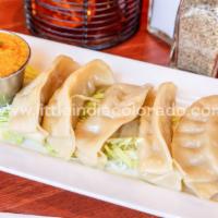 Momo · Indian style dumplings served with special onion chutney.