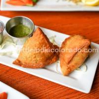 Meat Samosa · Crispy pastry with ground chicken, lamb and spices