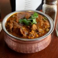 Fish Curry · Traditional dish of India carefully seasoned with an exotic blend of curry spices, onion, ga...