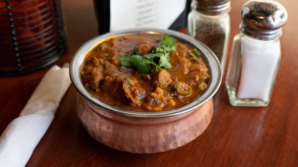 Fish Curry · Traditional dish of India carefully seasoned with an exotic blend of curry spices, onion, garlic, ginger and tomato in medium thick sauce. **Onions cannot be removed.