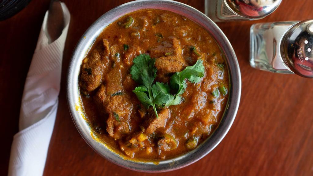 Combination Curry · Shrimp, lamb and chicken. Traditional dish of India carefully seasoned with an exotic blend of curry spices, onion, garlic, ginger and tomato in medium thick sauce. **Onions cannot be removed.