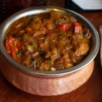 Shrimp Bhuna · Boneless meat pieces cooked with onion, tomatoes, bell peppers and spices. **Onions cannot b...
