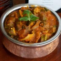 Bhindi Masala · Okra cooked with onion, tomatoes and spices. Vegan upon request.