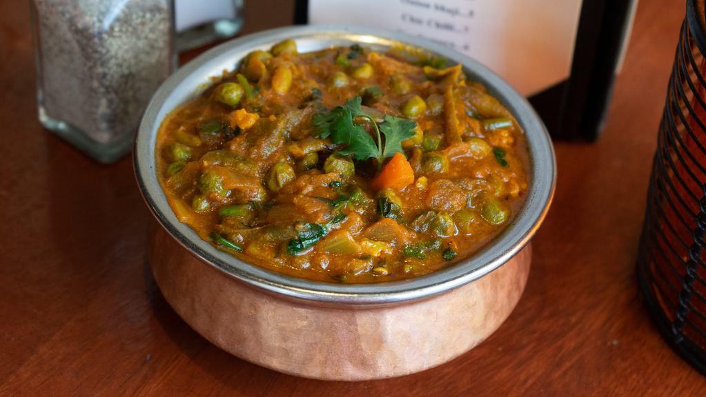 Vegetable Curry · Mixed vegetables seasoned in medium thick curry. Vegan upon request.