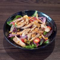 Avocado Chicken Salad · Chicken, romaine lettuce cherrie tomatoes, avocado, corn cilantro, red onions with our house...