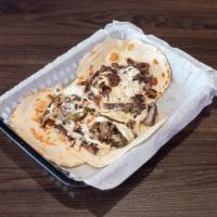Alambres · Beef with grilled pepper and onion with mozzarella cheese on 3 flour tortillas.