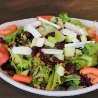 Julie’s Farmer Salad · Organic greens, tomatoes, goat cheese, walnuts, dried cranberries, green apple. House made b...