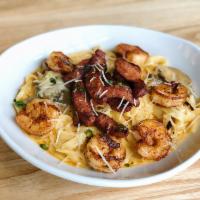 French Quarter Pasta · Andouille sausage and shrimp, fettuccine, slightly spicy Alfredo sauce, sauteed mushrooms.