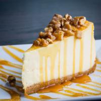 Salted Caramel Cheesecake · NY cheesecake topped with warm caramel, fresh ground sea salt and toasted walnuts.