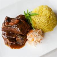 Double Braised Short Ribs · Guinness stout sauce. Served with pumpkin rice.