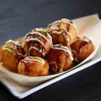 Age Takoyaki · Grilled and fried puffs of octopus with sauces, mayo and dried bonito flakes. (6 Piece)