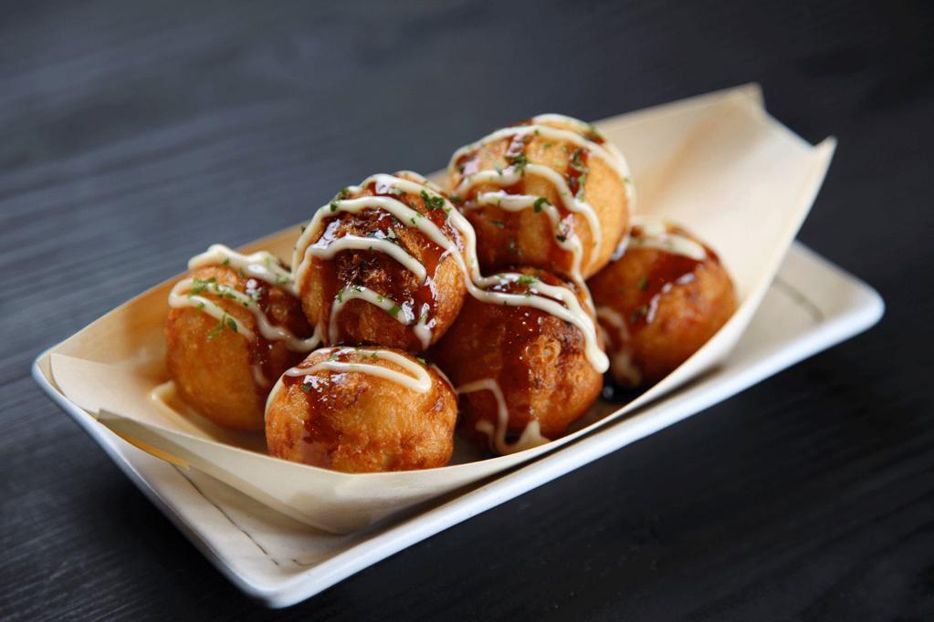 Age Takoyaki · Grilled and fried puffs of octopus with sauces, mayo and dried bonito flakes. (6 Piece)