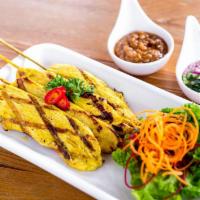 Satay · Marinated chicken skewers, grilled and served with homemade peanut sauce and fresh cucumber ...