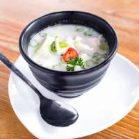 Tom Kha Gai · Chicken in coconut broth with aromatic Thai herbs.
