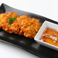 Sweet Corn Fritters · Fresh sweet corn kernels mixed in a batter with Thai curry paste. (4 Piece)