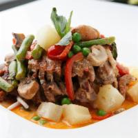 Duck Pineapple Curry · With pineapples, mushrooms and basil in red curry sauce