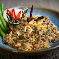 Larb Lanna · Ground pork seasoned with dried chilies, cumin, cloves, long peppers, star anises, sichuan p...