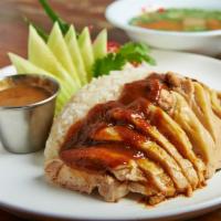 Khao Mun Gai (Over rice) · Juicy and tender slow cooked chicken served with ginger rice and special homemade sauce and ...