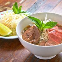Pho · Vietnamese beef noodle soup with rice noodles, beef, rare beef eye round, onions, celery and...
