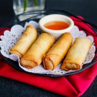 A2.Egg Rolls · Crispy rolls stuffed with glass noodles, carrots, mushrooms, cabbage, celery and served with...