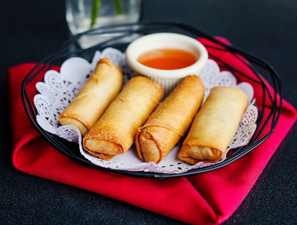 A2.Egg Rolls · Crispy rolls stuffed with glass noodles, carrots, mushrooms, cabbage, celery and served with homemade sweet chili sauce.