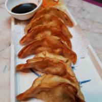 A3. Potsticker · Deep Fried Potsticker filled with chicken and vegetable. Served with sweet sour sauce.