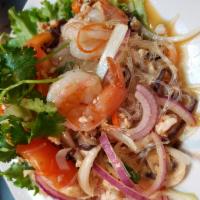 SL5.   Glass Noodle Salad · Glass noodles, shrimp, ground chicken, green onions, cilantro, red onions and tomatoes mixed...