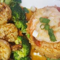SP4. Scampi Shrimp · Shrimp sauteed in garlic and black pepper sauce, served with steamed broccoli and carrots. S...