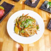Vegetable Yaki Udon · Pan-fried udon noodles with zucchini, carrots, and broccoli, topped with green onions.