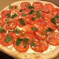 White Tomato Pizza · Extra mozzarella, spotted with whole milk ricotta, imported grated Romano and mozzarella.
