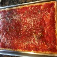 Upside Down Sicilian Pizza · Old fashioned style. Cheese on the bottom topped with extra sauce, imported grated Romano an...