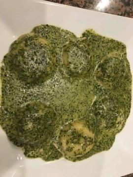 Spinach Ravioli in a Creamy Pesto Sauce - Large Order · Spinach ravioli In a creamy pesto sauce. Pasta served with bread.