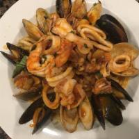 Linguine Fra Diavalo with Shrimp & Calamari · Fresh linguine served with shrimp and calamari in a special marinara sauce. Pasta served wit...