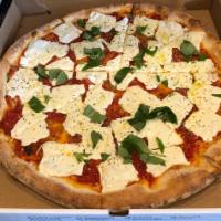 Margarita Pizza · Fresh mozzarella and plum tomato sauce topped with olive oil and basil.