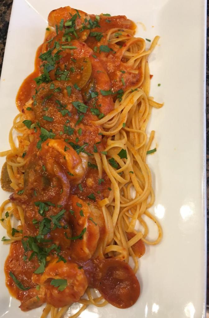 Shrimp Fra Diavolo · Jumbo shrimp baked with breadcrumbs, butter wine, lemon, garlic and olives oil. Served with your choice of side, Pasta or Salad and Bread.